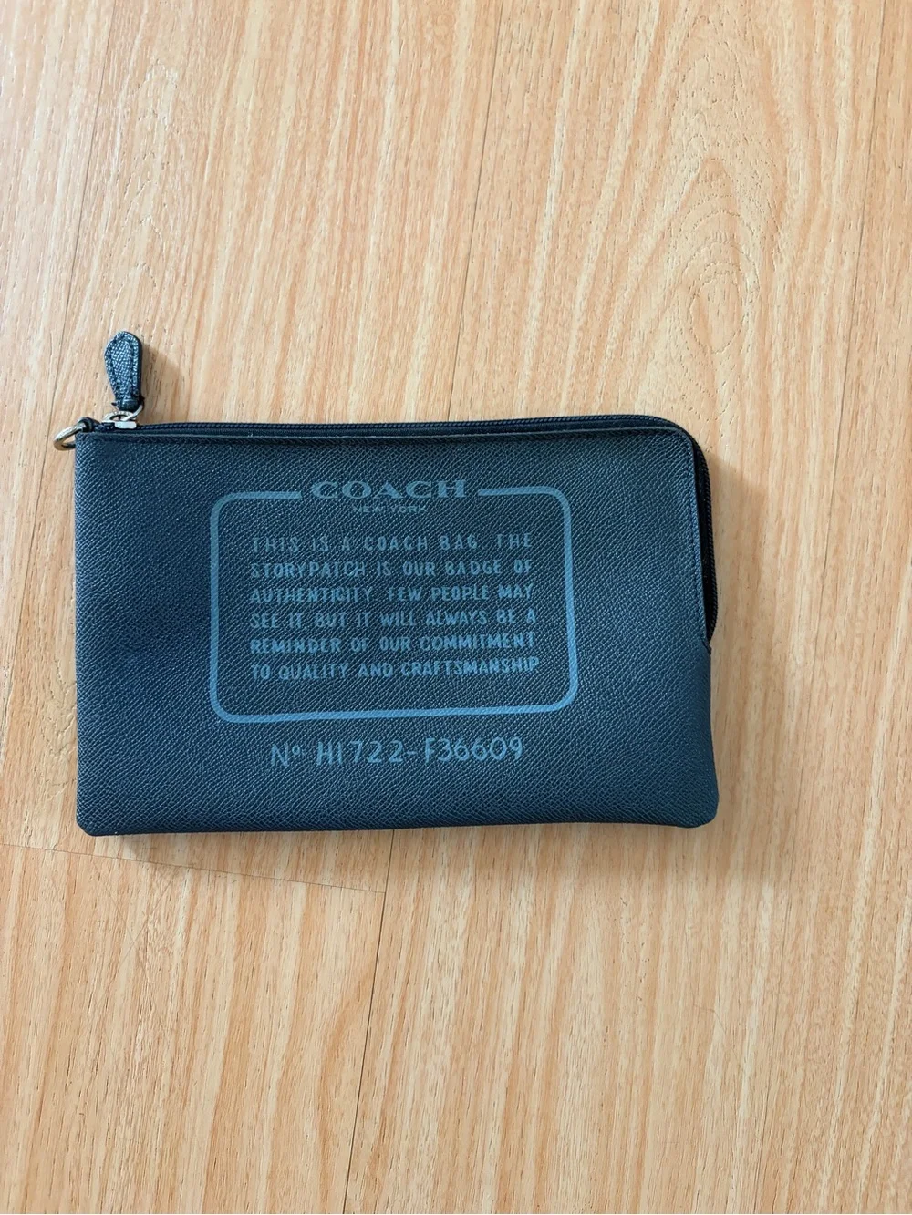 Coach Black Leather Pouch with Debossed Logo
